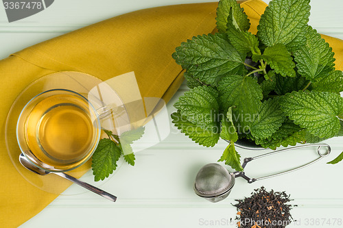 Image of Herbal tea with melissa in a glass cup