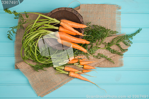 Image of Carrots on a wooden table