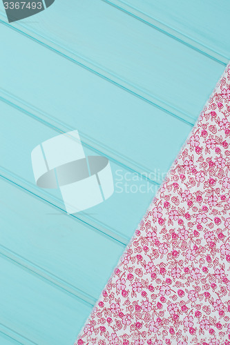 Image of Pink towel over wooden table