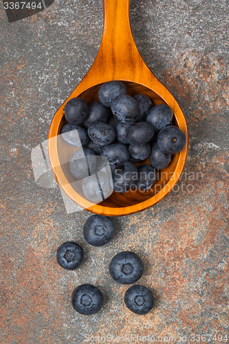 Image of Blueberries on a wooden spoon