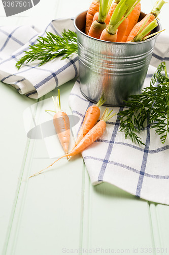 Image of Carrots on wooden table
