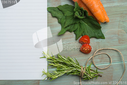 Image of White paper and vegetables