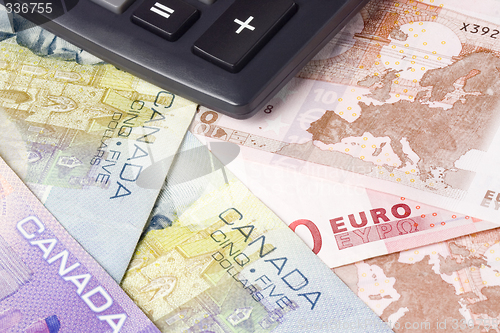 Image of Forex - Canadian and Euro currency pair with calculator

