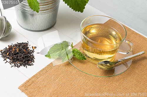Image of Herbal tea with melissa in a glass cup