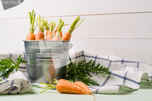 Image of Carrots on wooden table