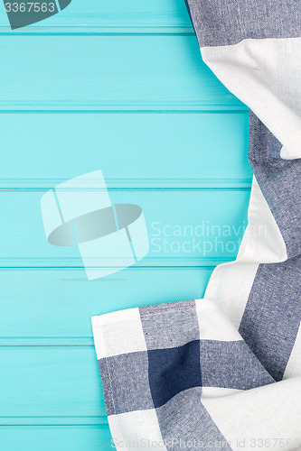 Image of Blue and white towel over table