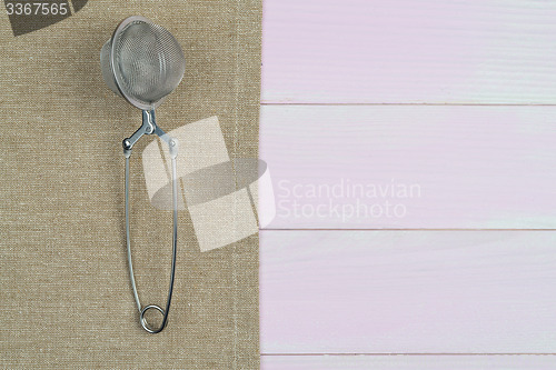Image of Kitchenware on beige towel