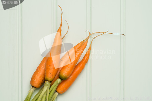 Image of Carrots on wooden table