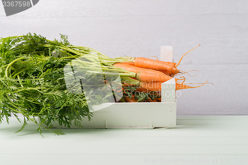 Image of Carrots on wooden table