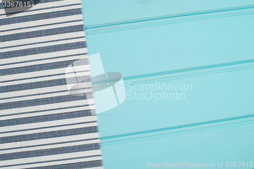 Image of Blue and white towel over table