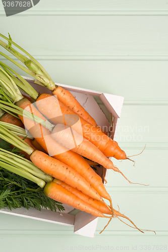 Image of Carrots on wooden table