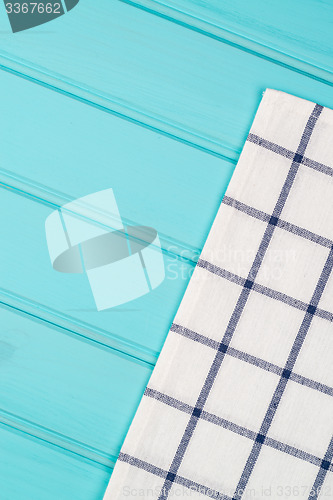 Image of Blue and white towel over table