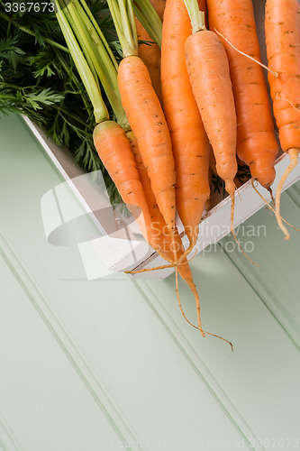 Image of Carrots on wooden table