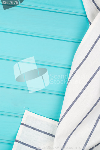 Image of Blue and white towel over table