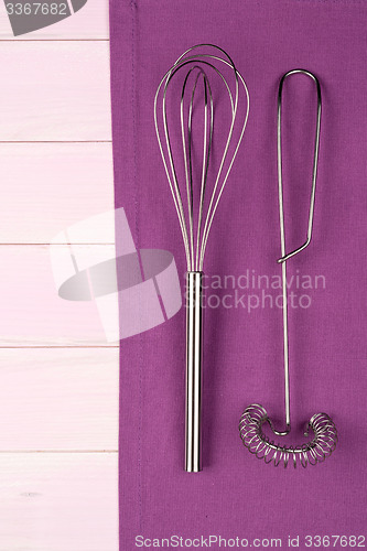 Image of Kitchenware on purple towel