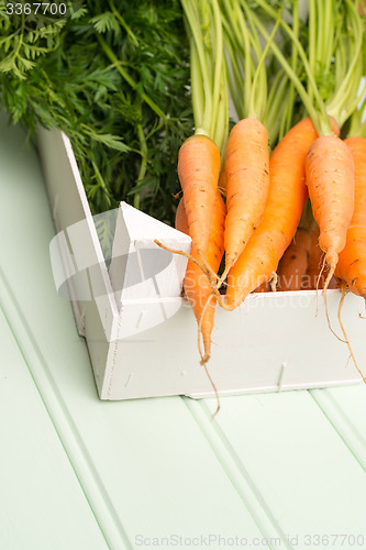 Image of Carrots on wooden table
