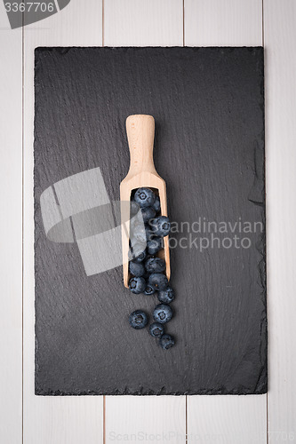 Image of Blueberries on a wooden spoon