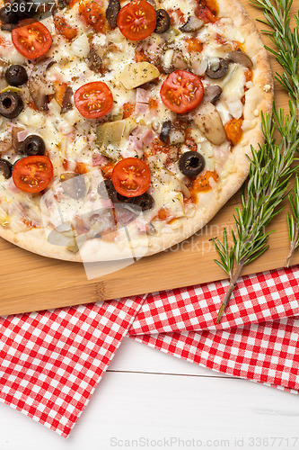 Image of Pizza with bacon, olives and tomato