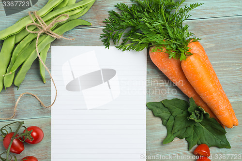 Image of White paper and vegetables