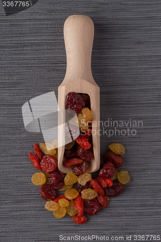 Image of Wooden scoop with mixed dried fruits