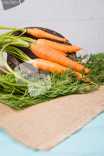 Image of Carrots on a wooden table