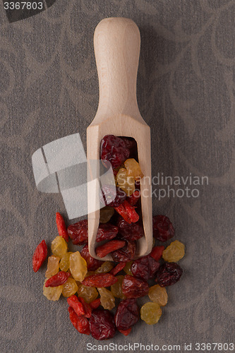 Image of Wooden scoop with mixed dried fruits