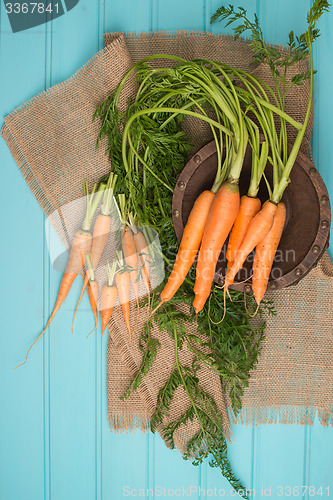 Image of Carrots on a wooden table