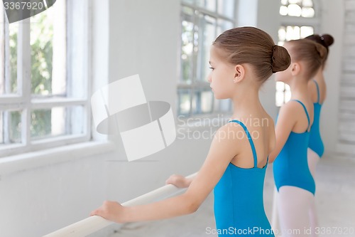 Image of Three little ballet girls posing together