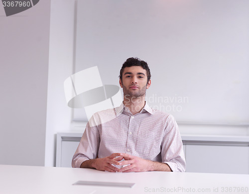 Image of young business man portrait  at modern office