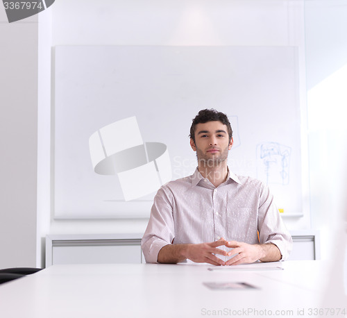 Image of young business man portrait  at modern office