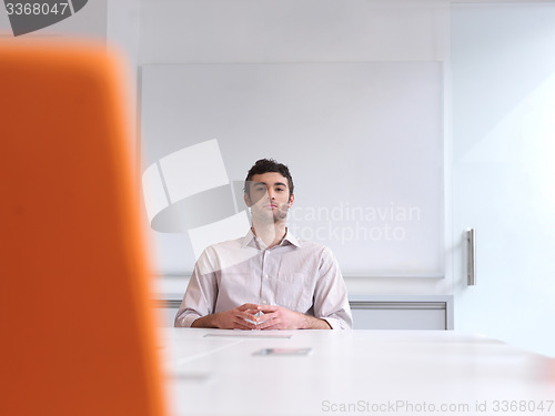 Image of young business man portrait  at modern office