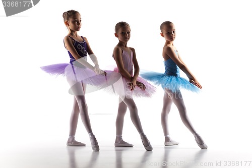 Image of Three little ballerinas dancing in dance studio