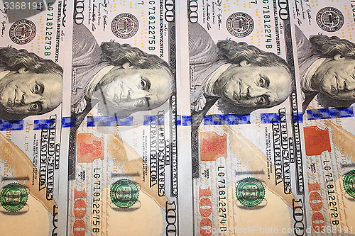 Image of hundred dollar bank notes