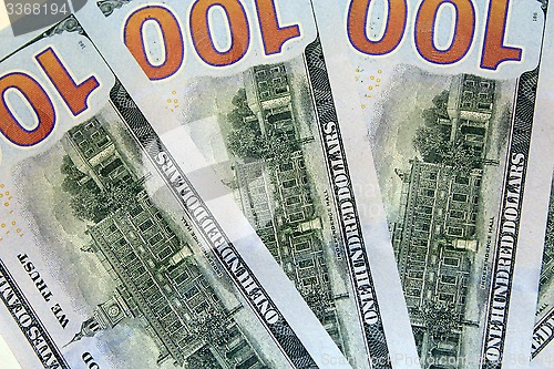 Image of reverse side of hundred dollar bank notes