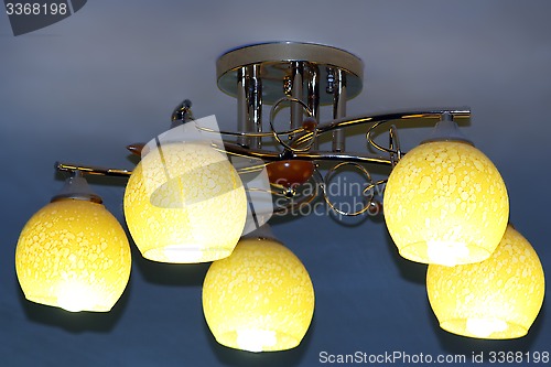 Image of Beautiful chandelier with five plafonds