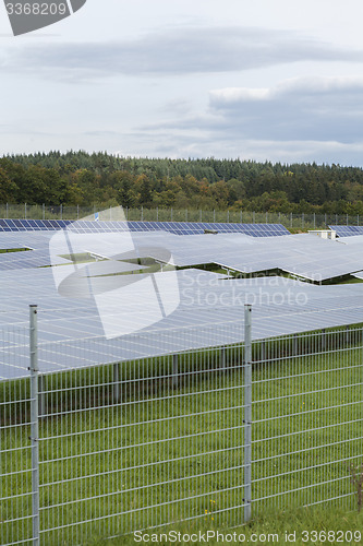 Image of Field with blue siliciom solar cells alternative energy