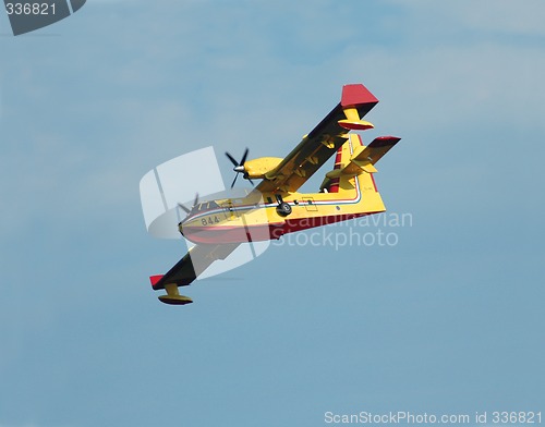 Image of Fire fighting airplane descending for  water.