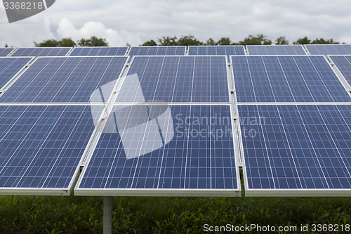 Image of Field with blue siliciom solar cells alternative energy