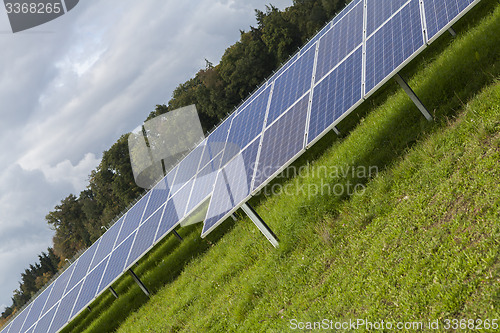 Image of Field with blue siliciom solar cells alternative energy