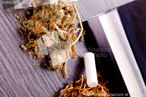 Image of Dried Cannabis on Rolling Paper with Filter