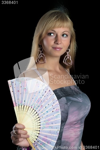 Image of Beautiful young smiling woman with fan