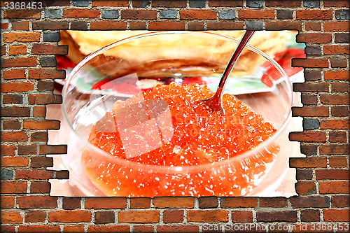 Image of broken brickwall with red caviar in plate