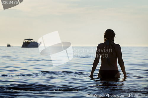 Image of Woman standing in shoal