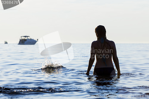Image of Woman standing in Adriatic sea