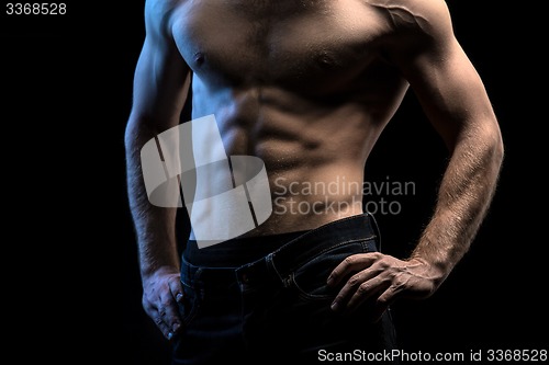 Image of Portrait of handsome athlete topless at the studio