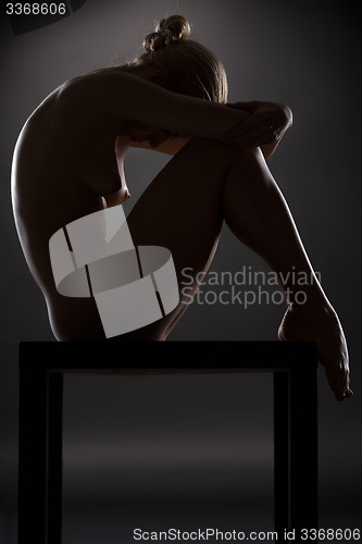 Image of Art nude picture of naked blonde in the studio