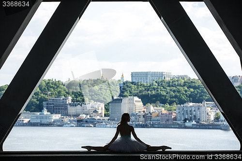 Image of Silhouette of graceful ballerina in white tutu