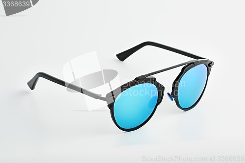 Image of Stylish glasses with blue tinted mirror