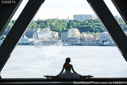 Image of Cropped picture legs of graceful ballerina in white tutu