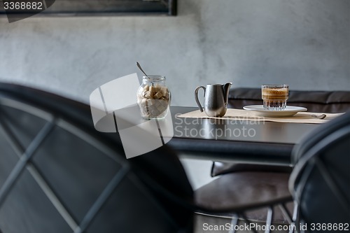 Image of Espresso on black glossy table